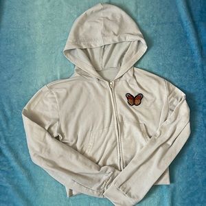 White cropped zip up hoodie with butterfly patch size small.